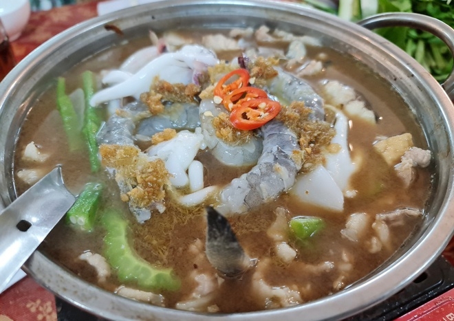 Bản in : 金瓯南根螃蟹和乌明鱼酱火锅被列入越南前100种特色美食名单 | Vietnam+ (VietnamPlus)