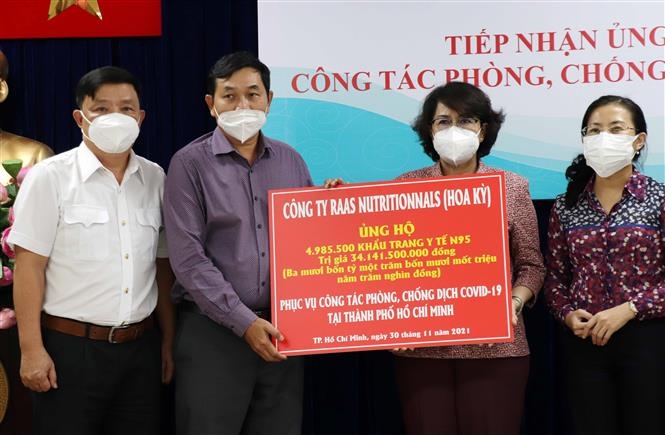 Bản in : 胡志明市接收由美国企业捐赠的5万只N95医用口罩 | Vietnam+ (VietnamPlus)