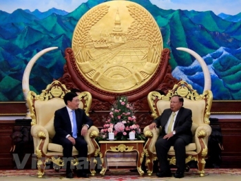 越南政府副总理兼外长范平明对老挝进行正式访问